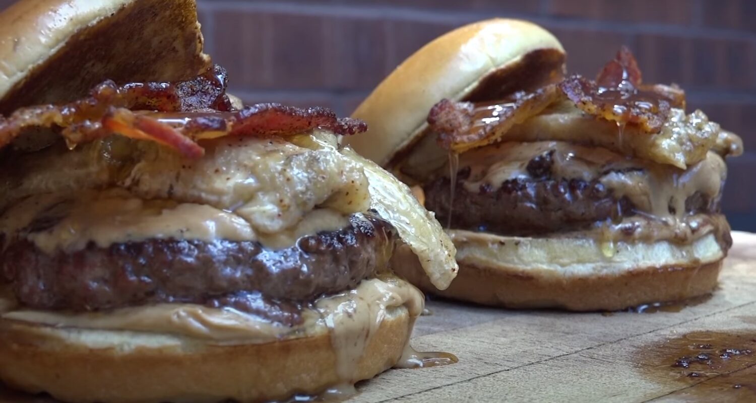 two grilled Evlis burgers with caramelized bananas and smoked bacon