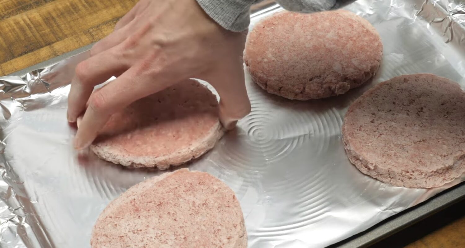 Frozen burgers on the foil