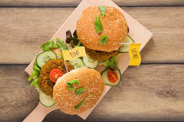 Top view, burgers on a wooden board
