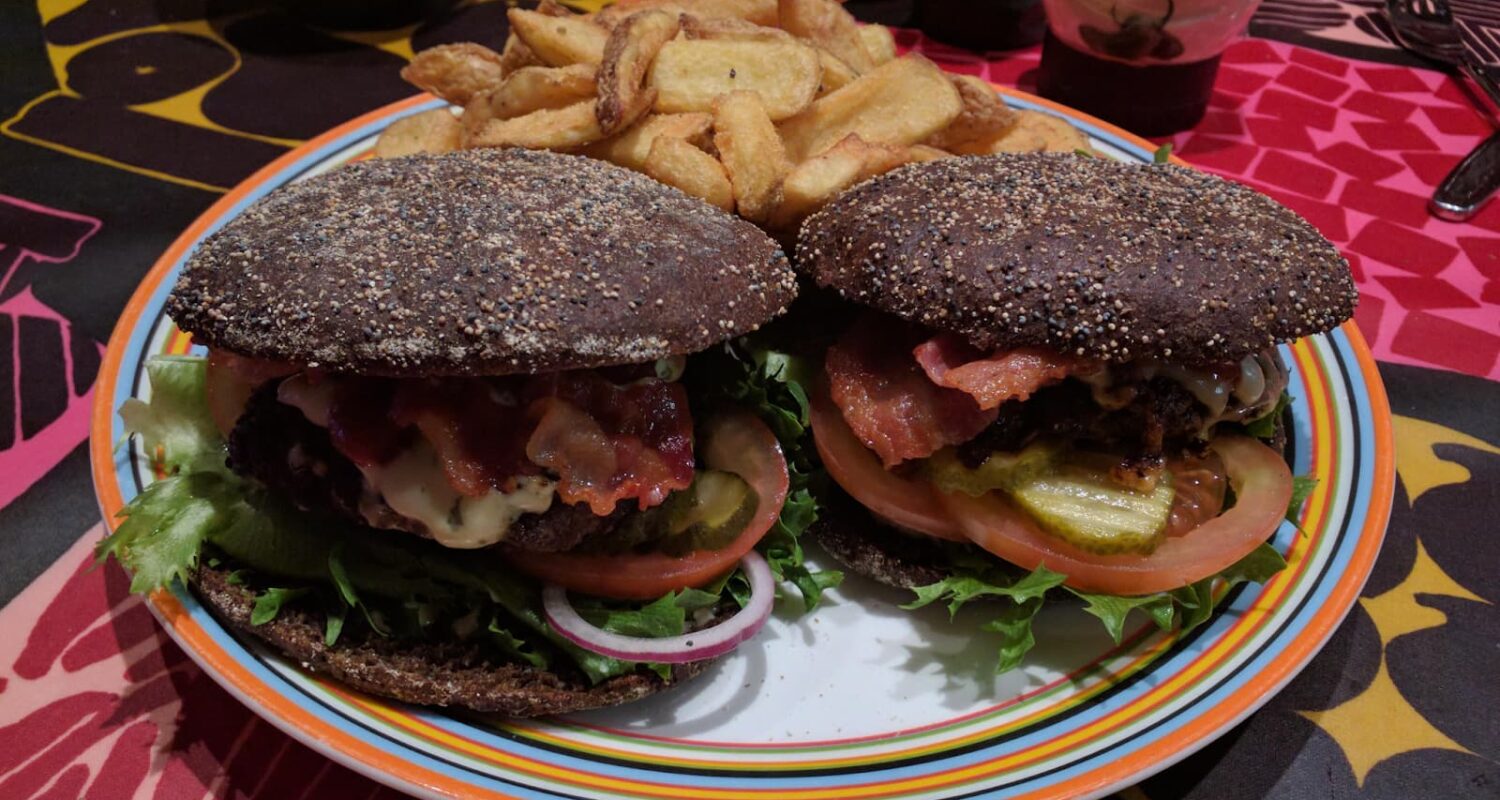 Homemade burger on rye bread with potatoes